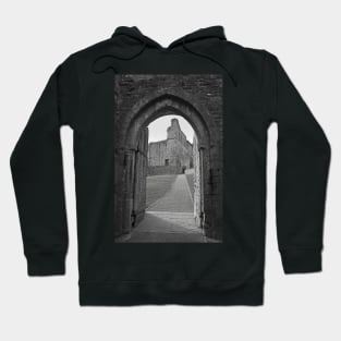 An ancient gateway in Chepstow castle offers views of the interior courtyard. Hoodie